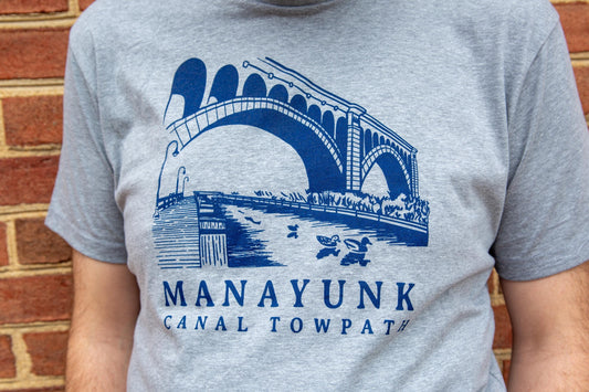 Illustration of the Manyunk towpath in philadelphia screen printed in blue on a Grey T shirt